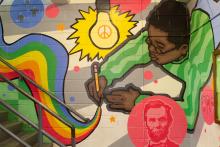 Mural of a student writing